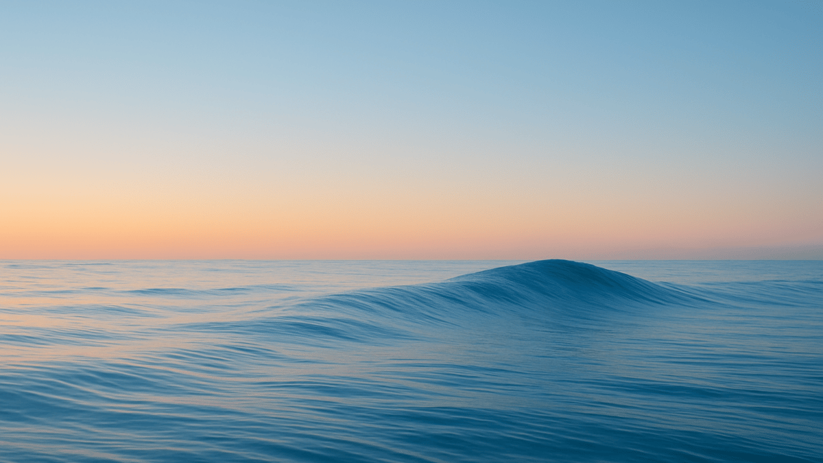 Calm ocean wave at sunset