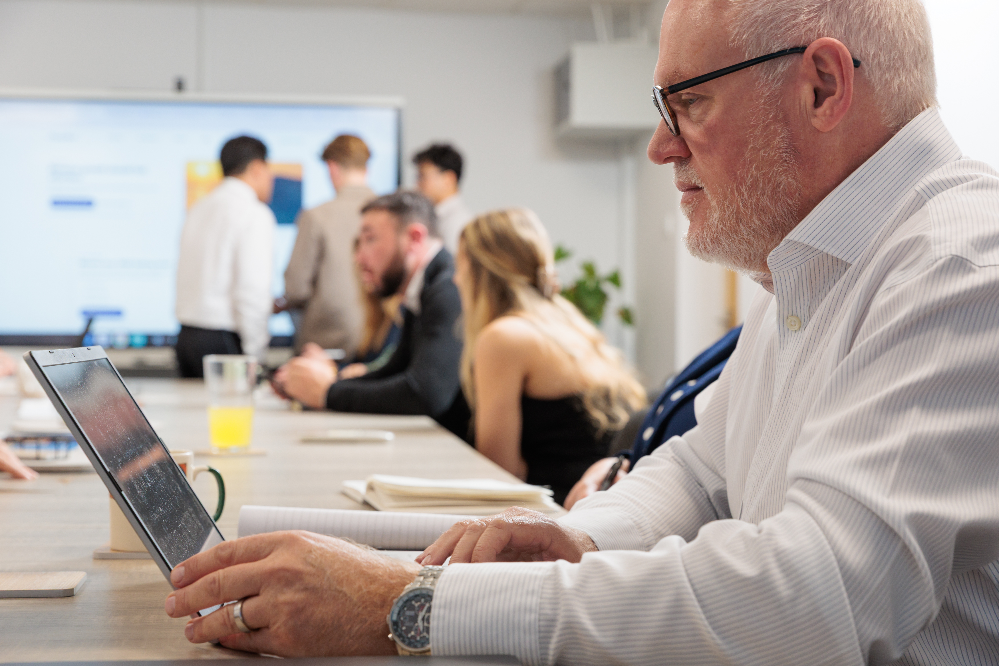 People discussing project updates around a table